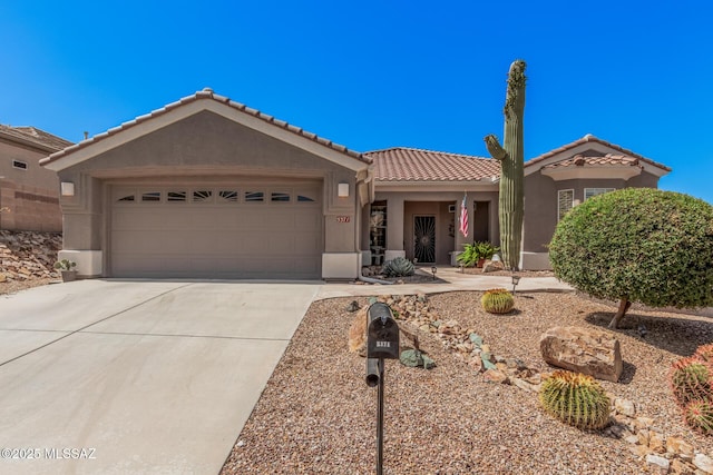 5371 W Leatherflower Ln, Marana, AZ 85658 - single story home featuring a garage, driveway, a tile roof, and stucco siding