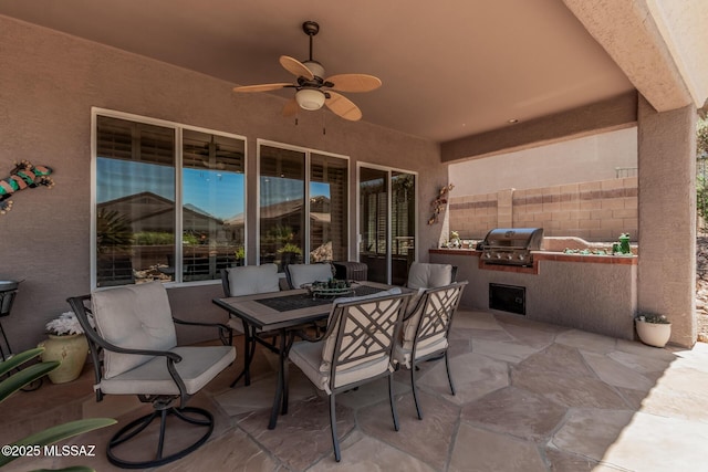 5371 W Leatherflower Ln, Marana, AZ 85658 - view of patio / terrace featuring exterior kitchen, ceiling fan, and outdoor dining area