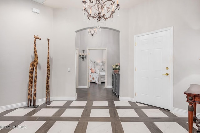 5371 W Leatherflower Ln, Marana, AZ 85658 - foyer featuring arched walkways and a chandelier