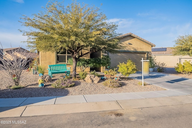 1123 E Lumberjack Trl, Sahuarita, AZ 85629 - view of front of house with stucco siding, concrete driveway, and a garage