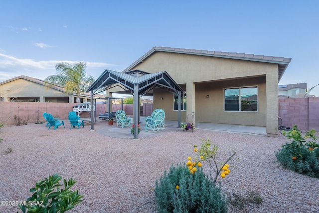 1123 E Lumberjack Trl, Sahuarita, AZ 85629 - rear view of house with a patio, a gazebo, a fenced backyard, and stucco siding