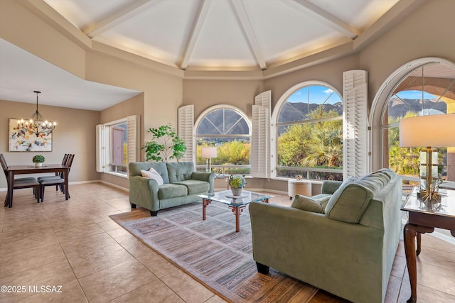 6265 N Jochums Dr, Tucson, AZ 85718 - living area with a towering ceiling, a chandelier, beam ceiling, and tile patterned floors