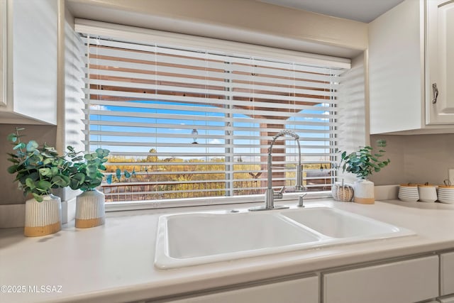 6265 N Jochums Dr, Tucson, AZ 85718 - kitchen view of white cabinets and light countertops