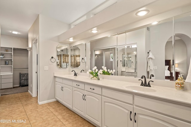 6265 N Jochums Dr, Tucson, AZ 85718 - ensuite bathroom featuring double vanity, tile patterned flooring, recessed lighting, and a closet