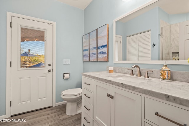 6265 N Jochums Dr, Tucson, AZ 85718 - full bathroom featuring vanity, wood finished floors, a shower, and a closet