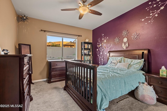 6265 N Jochums Dr, Tucson, AZ 85718 - bedroom featuring light carpet and a ceiling fan