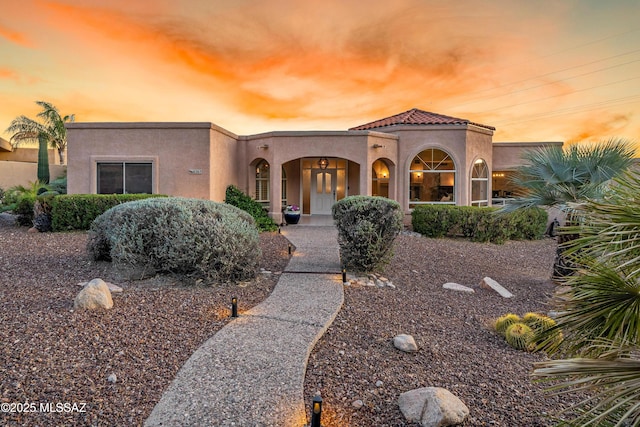 6265 N Jochums Dr, Tucson, AZ 85718 - mediterranean / spanish house featuring stucco siding and a tiled roof