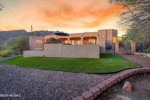 6265 N Jochums Dr, Tucson, AZ 85718 - fenced front yard with a gate and a mountain view