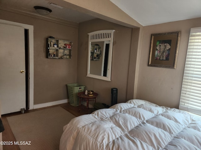 815 E 8th St, Tucson, AZ 85719 - bedroom featuring wood finished floors and vaulted ceiling