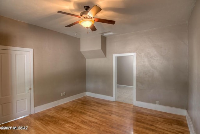 815 E 8th St, Tucson, AZ 85719 - unfurnished room featuring wood finished floors and a ceiling fan