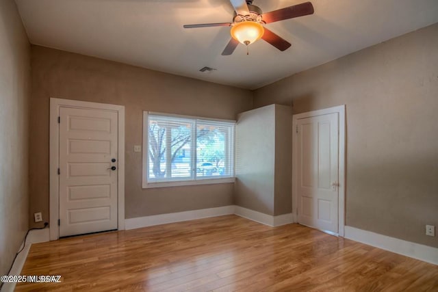 815 E 8th St, Tucson, AZ 85719 - spare room featuring light wood finished floors and ceiling fan