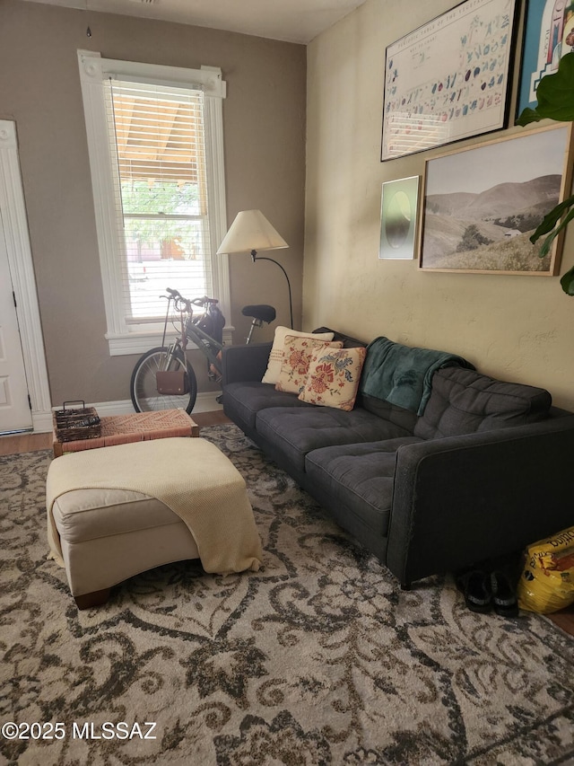 815 E 8th St, Tucson, AZ 85719 - living room featuring baseboards