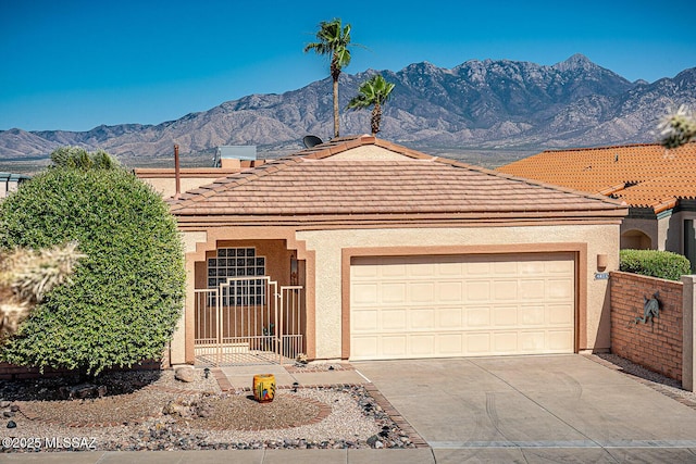 4823 S View Ridge Dr, Green Valley, AZ 85622 - view of front facade with driveway, a garage, a tiled roof, and stucco siding