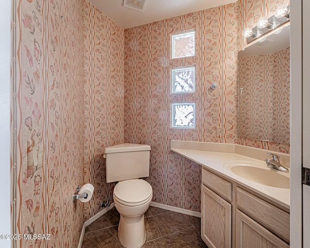 4823 S View Ridge Dr, Green Valley, AZ 85622 - bathroom with vanity, wallpapered walls, and tile patterned floors