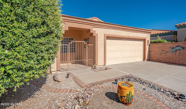 4823 S View Ridge Dr, Green Valley, AZ 85622 - garage with concrete driveway and a gate
