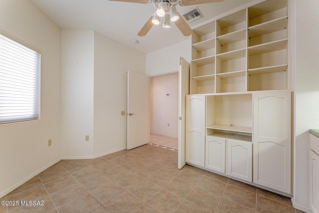 4823 S View Ridge Dr, Green Valley, AZ 85622 - unfurnished bedroom with light tile patterned floors and ceiling fan