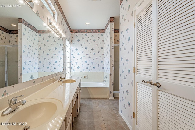 4823 S View Ridge Dr, Green Valley, AZ 85622 - full bathroom featuring wallpapered walls, a bath, a closet, tile patterned floors, and double vanity