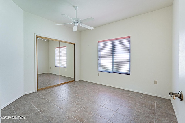 4823 S View Ridge Dr, Green Valley, AZ 85622 - unfurnished bedroom with a closet and a ceiling fan