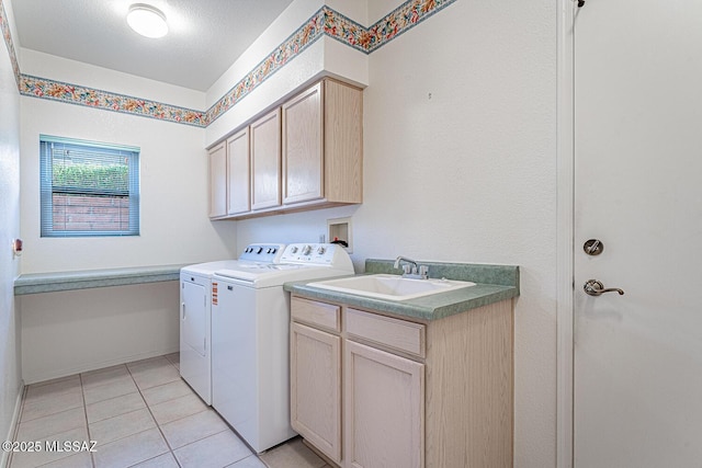 4823 S View Ridge Dr, Green Valley, AZ 85622 - washroom featuring cabinet space, washer and clothes dryer, and light tile patterned floors