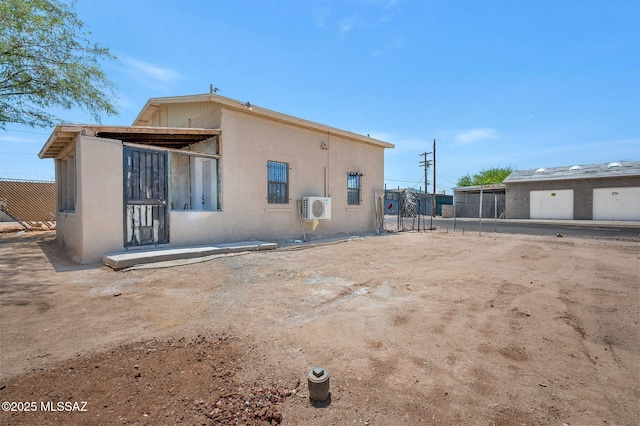 43 W Rillito St, Tucson, AZ 85705 - rear view of property featuring stucco siding