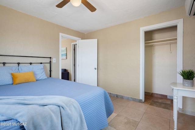 43 W Rillito St, Tucson, AZ 85705 - bedroom featuring a wall mounted air conditioner, a closet, ceiling fan, and light tile patterned flooring
