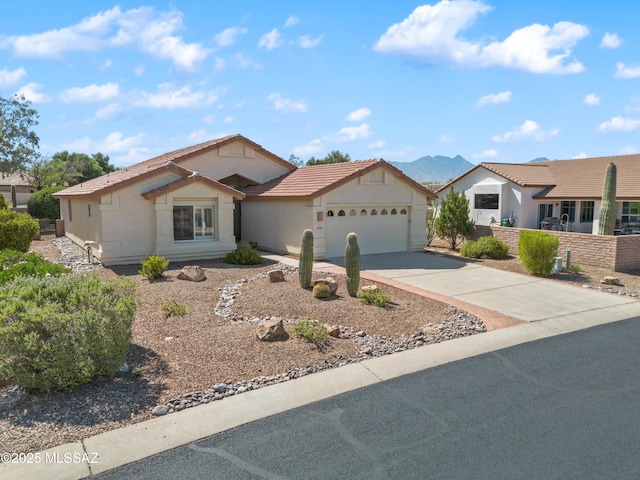1993 E Desert Lark Pass, Green Valley, AZ 85614 - ranch-style house featuring a garage, driveway, stucco siding, and a tiled roof