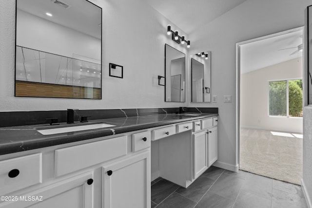 1993 E Desert Lark Pass, Green Valley, AZ 85614 - full bath featuring double vanity, vaulted ceiling, and a ceiling fan