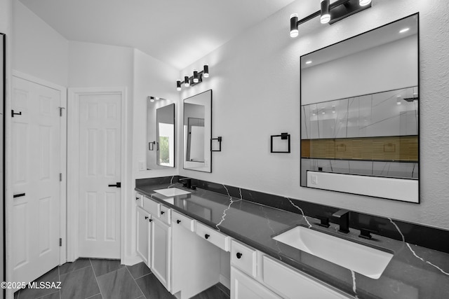 1993 E Desert Lark Pass, Green Valley, AZ 85614 - bathroom featuring double vanity, tile patterned floors, and a shower