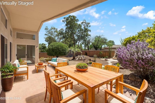 1993 E Desert Lark Pass, Green Valley, AZ 85614 - fenced backyard with a patio, an outdoor hangout area, and outdoor dining area