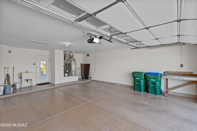 1993 E Desert Lark Pass, Green Valley, AZ 85614 - garage with gas water heater and a garage door opener