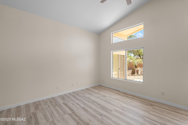 1993 E Desert Lark Pass, Green Valley, AZ 85614 - empty room with ceiling fan, light wood-type flooring, and high vaulted ceiling