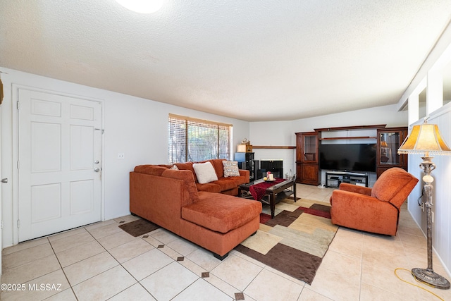 5521 E Camden St, Tucson, AZ 85712 - living room with light tile patterned floors and a textured ceiling