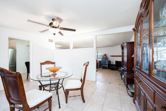 5521 E Camden St, Tucson, AZ 85712 - dining room featuring a ceiling fan, light tile patterned flooring, and a textured ceiling