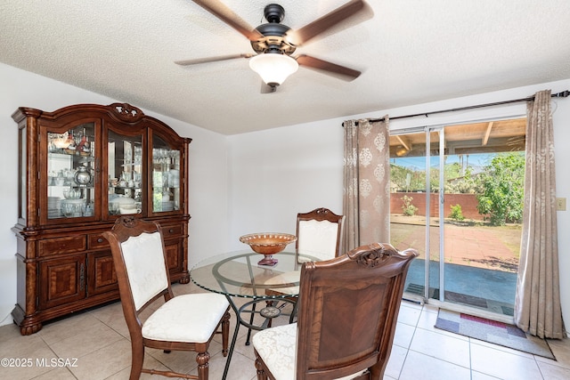 5521 E Camden St, Tucson, AZ 85712 - dining area featuring a ceiling fan, a textured ceiling, and light tile patterned floors