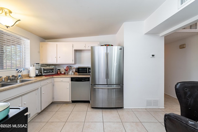5521 E Camden St, Tucson, AZ 85712 - kitchen featuring stainless steel appliances, light countertops, white cabinetry, and light tile patterned floors