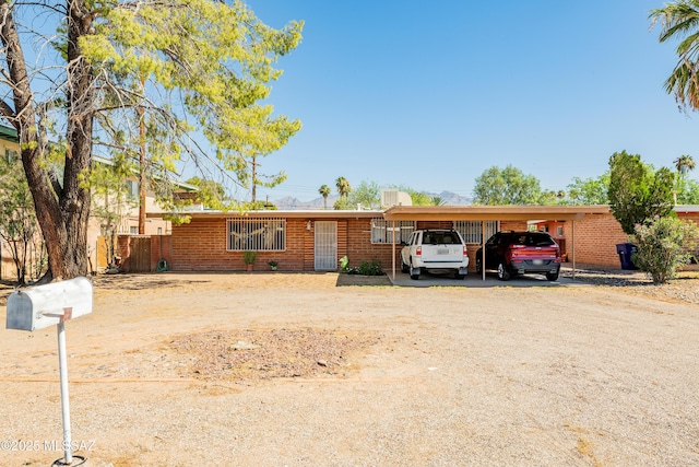 5521 E Camden St, Tucson, AZ 85712 - single story home featuring dirt driveway and a detached carport