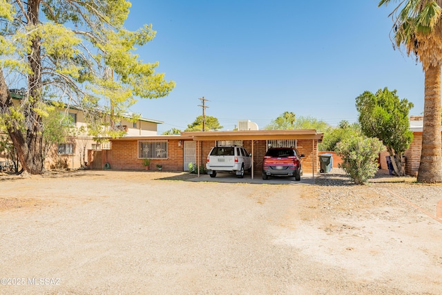 5521 E Camden St, Tucson, AZ 85712 - single story home with a carport and dirt driveway