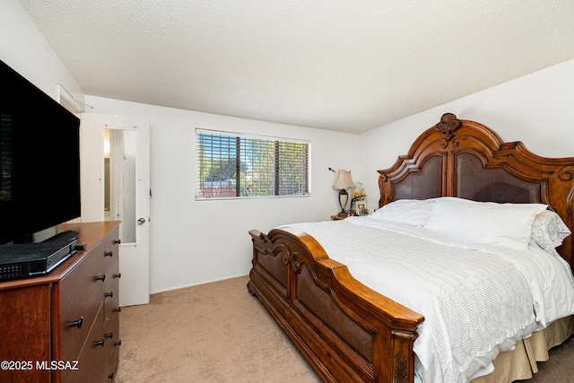 5521 E Camden St, Tucson, AZ 85712 - bedroom featuring light colored carpet and a textured ceiling