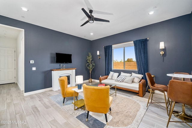 1144 S Castar Dr, Tucson, AZ 85745 - living area featuring ceiling fan, light wood-style floors, recessed lighting, and a fireplace