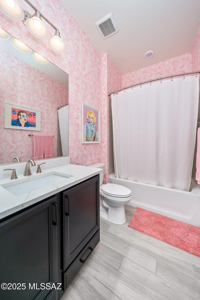 1144 S Castar Dr, Tucson, AZ 85745 - full bath with wallpapered walls, vanity, and shower / bathtub combination with curtain