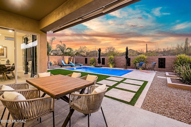 1144 S Castar Dr, Tucson, AZ 85745 - fenced backyard with a patio area and outdoor dining space