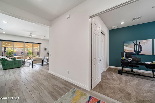 1144 S Castar Dr, Tucson, AZ 85745 - corridor featuring a desk, wood finished floors, and recessed lighting