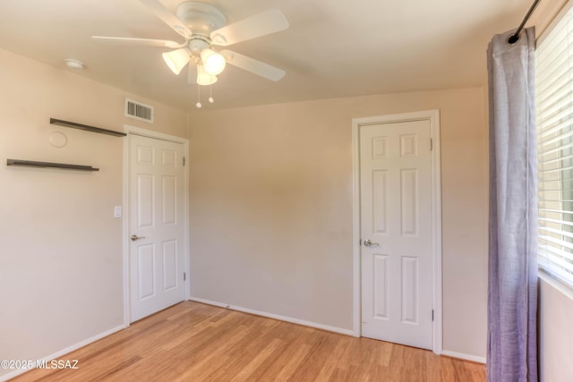 626 S Kellond Pl, Tucson, AZ 85710 - unfurnished bedroom featuring light wood-style flooring and ceiling fan