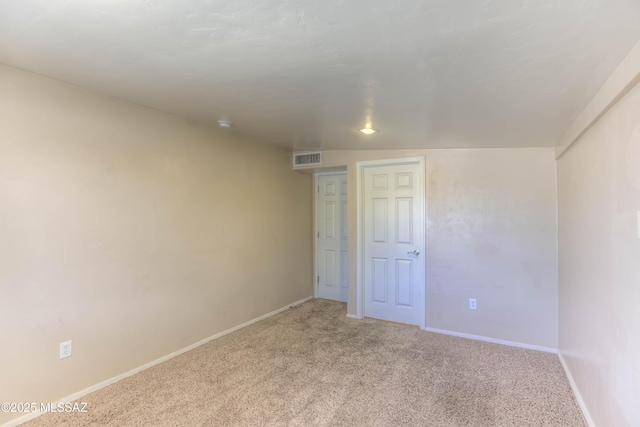 626 S Kellond Pl, Tucson, AZ 85710 - spare room featuring light carpet and baseboards