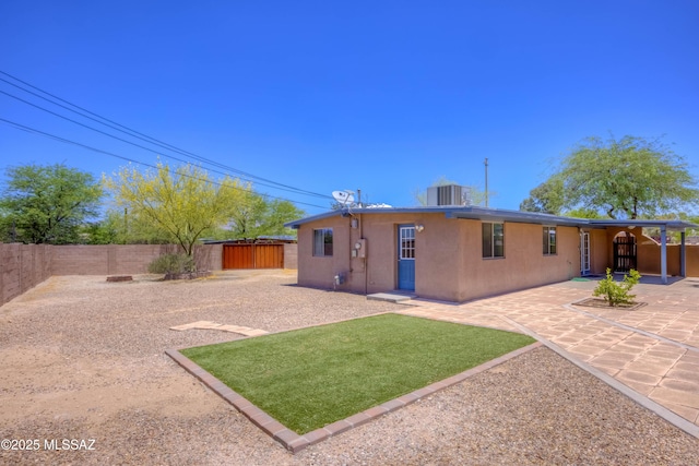 626 S Kellond Pl, Tucson, AZ 85710 - rear view of property featuring a fenced backyard, a patio, and stucco siding
