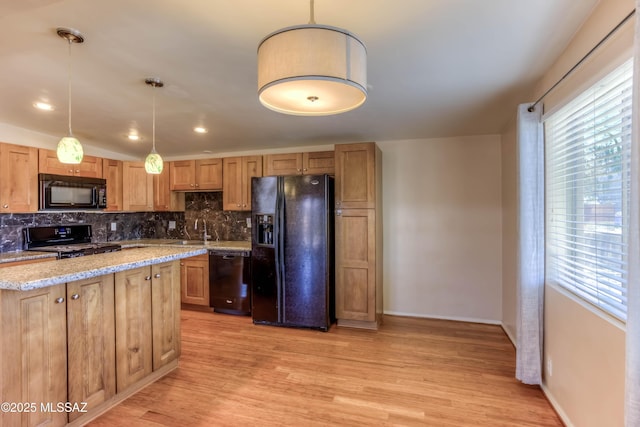 626 S Kellond Pl, Tucson, AZ 85710 - kitchen featuring black appliances, backsplash, light wood finished floors, light stone countertops, and pendant lighting