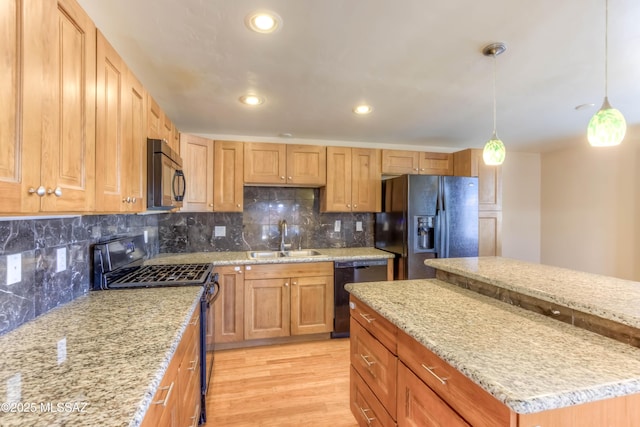 626 S Kellond Pl, Tucson, AZ 85710 - kitchen featuring black appliances, light wood-style flooring, backsplash, light stone counters, and recessed lighting