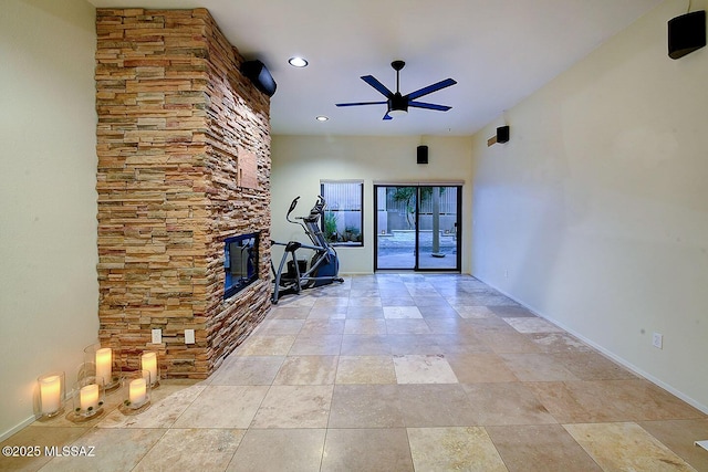6530 N Finisterra, Tucson, AZ 85750 - unfurnished living room featuring ceiling fan, a stone fireplace, and recessed lighting