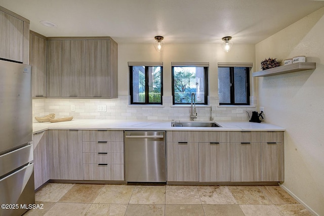 6530 N Finisterra, Tucson, AZ 85750 - kitchen featuring appliances with stainless steel finishes, light brown cabinetry, modern cabinets, and backsplash