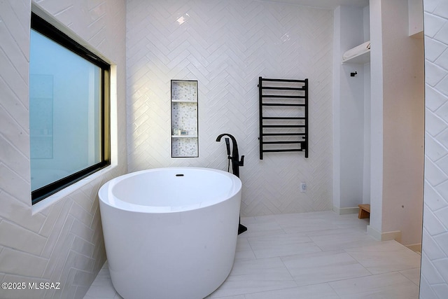 6530 N Finisterra, Tucson, AZ 85750 - full bathroom featuring radiator, a freestanding bath, and a towel warming rack